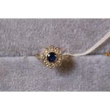 18ct Gold Circular Sapphire and Diamond rub over set Daisy design ring. 4.6g total weight. Size M