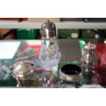 Collection of Silver Cruet ware 250g without blue glass liners and a Silver-plated Caster