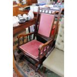 American Walnut framed rocking chair with upholstered back and seat
