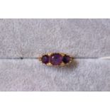 Ladies 9ct Gold Amethyst set dress ring of 3 stones, 5g total weight. Size M