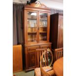 Edwardian Glazed cabinet over cupboard base with inlaid panel doors and bracket feet. Surmounted