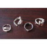 Collection of 3 Shark Design SIlver rings and a Jurassic design Silver ring. Size M