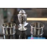 Small George III urn shaped Pepperette London 1786 marked RH and a Pair of Silver Napkin rings