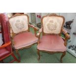 Pair of upholstered Louis style carved Elbow chairs with tapestry backs and scroll feet