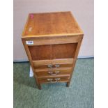 Oak Sewing cabinet with hinged top above 3 drawers