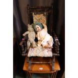 Childs American Rocking chair with a Porcelain headed doll and Mohair Bear