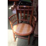 Edwardian Oak elbow chair with oval upholstered seat over turned supports