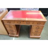 Oak Leather topped pedestal desk of 9 drawers with brass drop handles