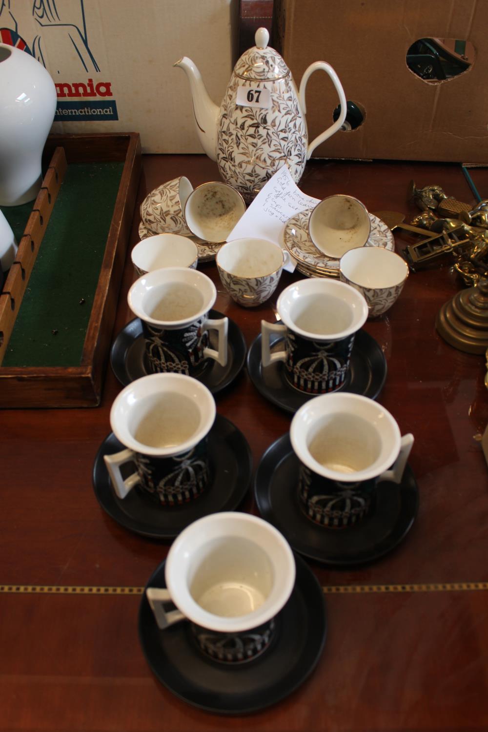 Gilded Bone China Coffee Set and a Portmeirion Magic City set of Coffee cans and Saucers