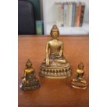 A Chinese Sino Tibetan style gilt bronze figure of Buddha, seated in bhumisparsha mudra and 2