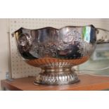 Large Silver Plate on Copper Monteith with Lions head handles, and fluted decoration. 32cm in