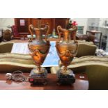 Pair of Gilt Metal two handled urn table lights on squared marble bases supported on gilt feet. 52cm