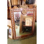 Large French style bevel edge mirror on walnut frame with applied ceramic plaques with applied