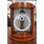 Kieninger mantel clock, Walnut and glass case, the movement striking, 34cm in Height