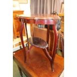 Victorian Mahogany shaped table with under tier on splayed legs