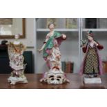 3 European Hard Paste figures of a Classical figure of a woman with bird and 2 others. 27cm