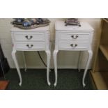 Pair of 20thC White bedside drawers with brass foliate handle over outstretched legs.
