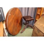 19thC Rosewood tilt top table on highly carved tripod base. 124cm in Diameter