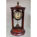 German Hac clock in wooden turned pillar supported case with key