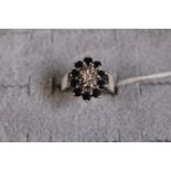 Ladies 9ct White Gold Sapphire & Diamond set cluster ring, 5.3g total weight. Size 0