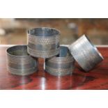 Set of 4 Silver Napkin rings and a Pair of SIlver Galleried Wine coasters