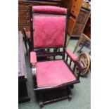 Mahogany framed upholstered American rocking elbow chair