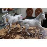 2 Beswick Palomino horses cantering with marks to feet