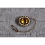 Good quality 19thC Brooch with Oval cut Citrine surrounded by seed pearls with gold back and