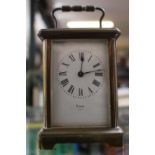 Voked of Paris Brass cased Carriage clock with roman numeral dial with key