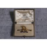 Cased 9ct Gold The Queens Regiment Bar brooch with enamelled detail in Goldsmiths and Silversmiths