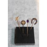 Collection of 4 19thC and later stick pins inc enamelled mourning pin, Amethyst set, Horseshoe pin