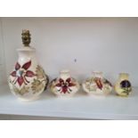 Moorcroft Floral decorated lamp base, Pair of matching vases and a Squat vase with impressed marks