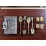 Silver Pin dish on peg feet, 2 Silver Napkin rings and assorted Silver spoons 130g total weight