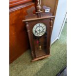 Oak cased wall clock with roman numeral dial