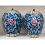 Pair of Chinese Famille Rose blue ground hexagonal Vases with floral decoration, printed mark to