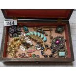 Walnut box of assorted Costume jewellery mainly Brooches