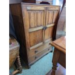 Oak Linenfold Cabinet with 2 drawers to base on bracket feet with a matching bedside unit