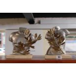 Pair of Interesting Modernist Male and Female busts with Olive leaf decoration on marble square