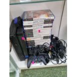 Playstation 2 with assorted accessories and Games