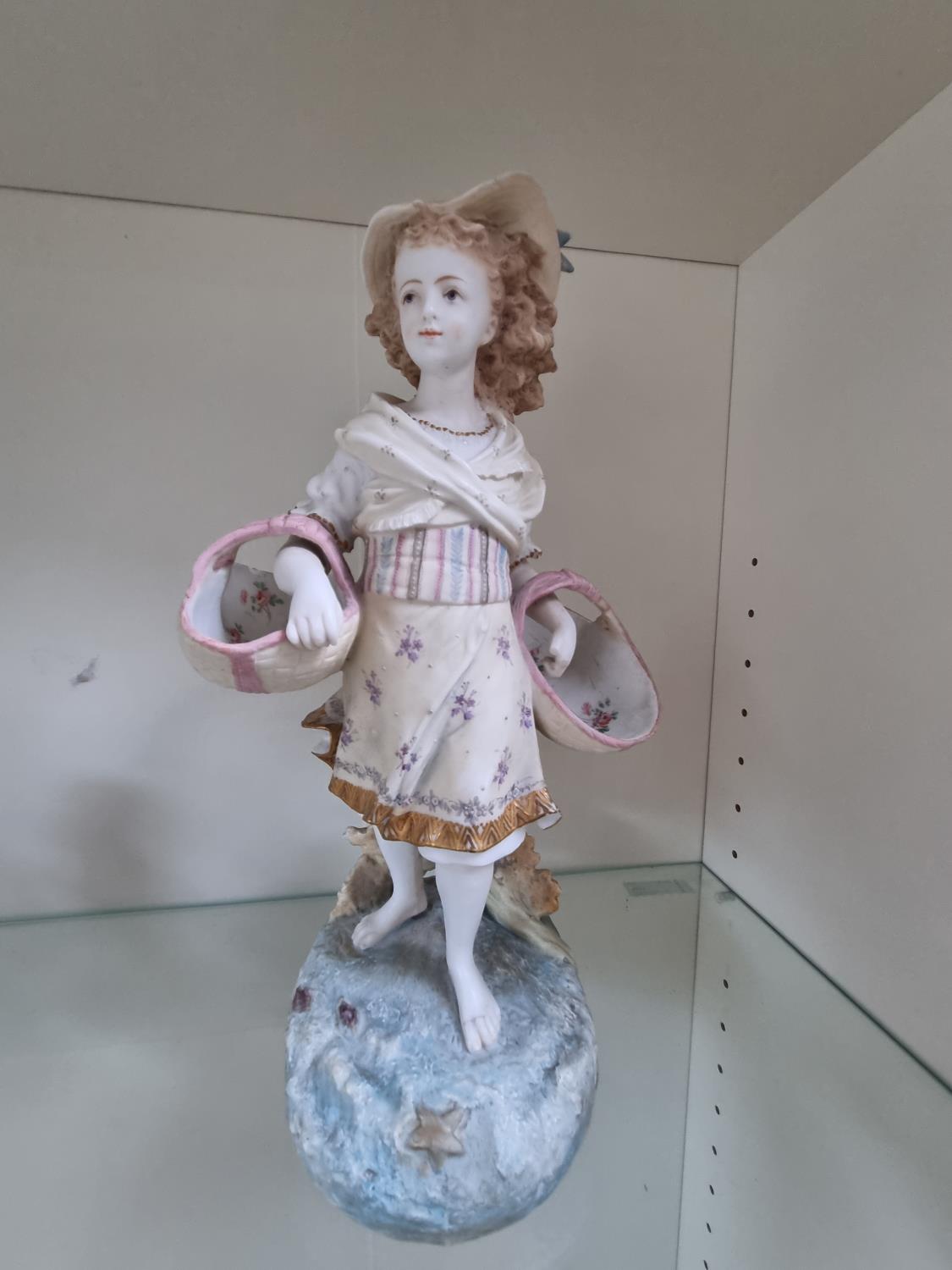 Large Bisque figure of a Edwardian Girl with flower baskets with hand painted decoration