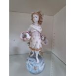 Large Bisque figure of a Edwardian Girl with flower baskets with hand painted decoration