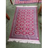 Red Ground Rug with tassel ends
