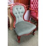 Upholstered Spoon back button back saloon chair on brass casters