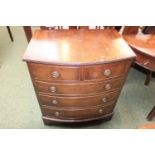Bow fronted chest of 5 drawers with brass drop handles upon bracket feet