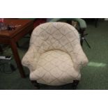 Low Upholstered button back chair on turned supports