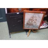 Metal embossed fire screen with Dragon decoration and a Wooden framed fire screen with Galleon