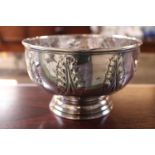 Silver bowl with leaf embossed decoration on footed base 340g total weight marked Sterling