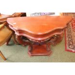 Shaped hall table with carved detail to legs over under tier