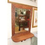 Wooden carved wall mirror with integral shelf