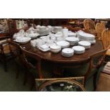 Edwardian wind out table with two leaves on brass casters with winder